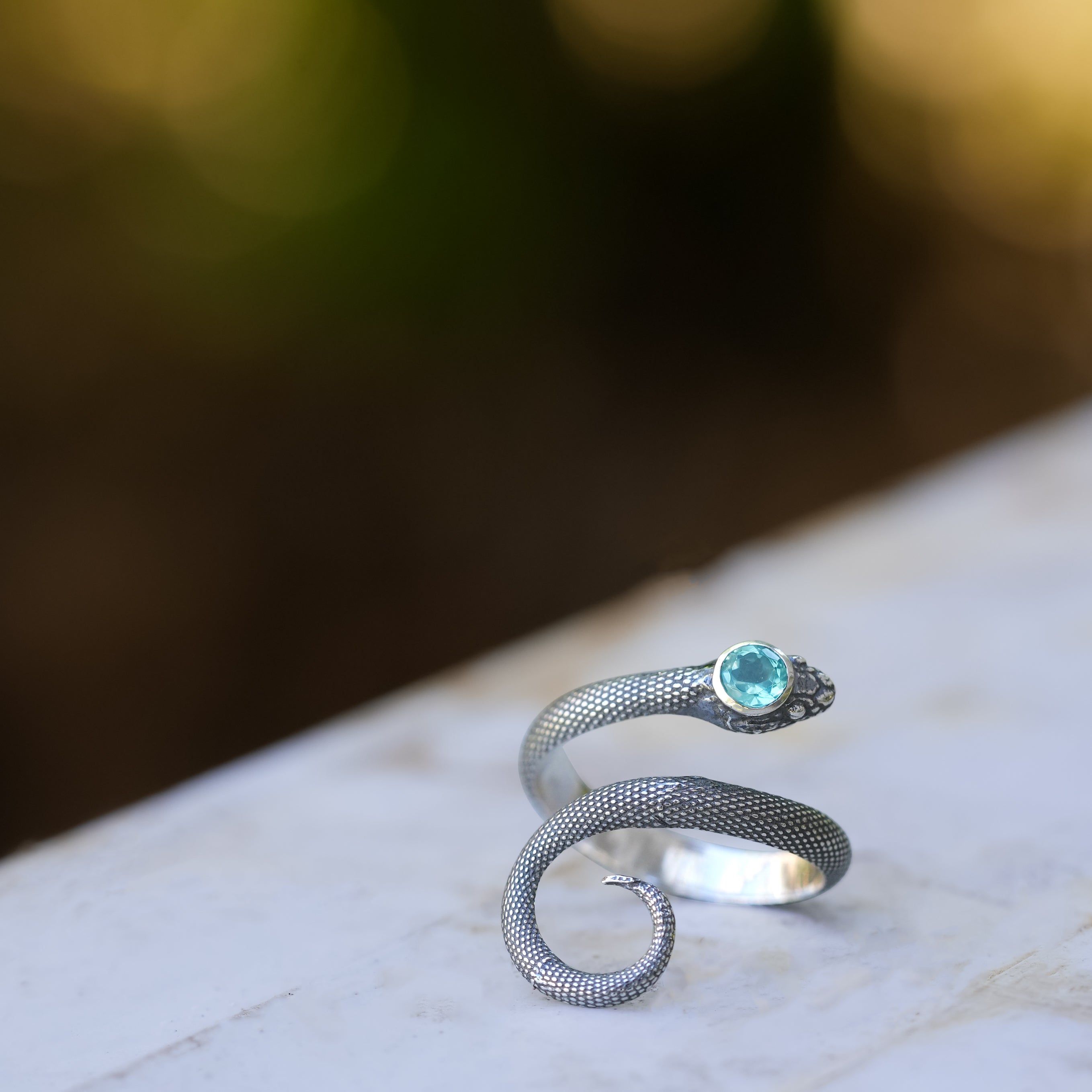 Starborn Coiled Snake Ring with Faceted Apatite in Sterling Silver