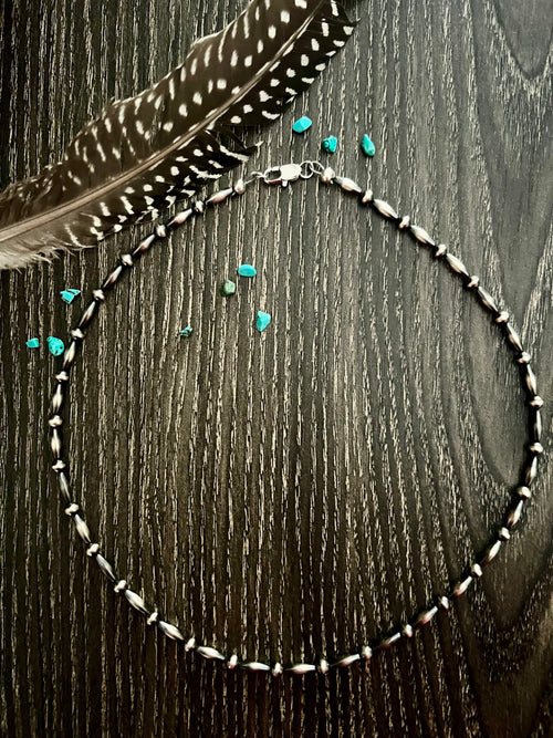 Hand crafted sterling silver pearls alternating with torpedo beads. 
Making a perfect addition to any stack.
